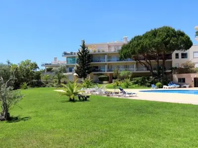 a resort with a lawn and a swimming pool at Happiness Apartment by Stay ici Algarve Holiday Rental in Albufeira