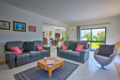 a living room with two couches and a coffee table at Villa Jorge by Villa Plus in Albufeira