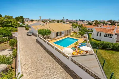an aerial view of a house with a swimming pool at Villa Neptuno Sol by Villa Plus in Albufeira
