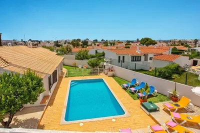 an image of a swimming pool in a villa at Villa Neptuno Sol by Villa Plus in Albufeira