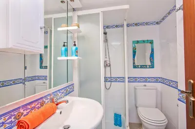a bathroom with a toilet and a sink at Villa Neptuno Sol by Villa Plus in Albufeira