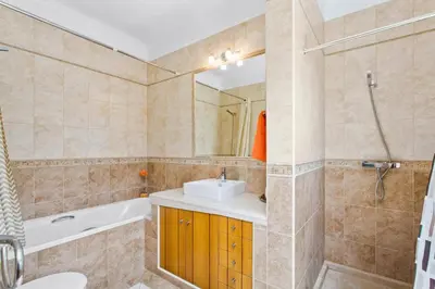 a bathroom with a sink and a bath tub and a sink at Villa Ribeiro Tomas by Villa Plus in Loulé