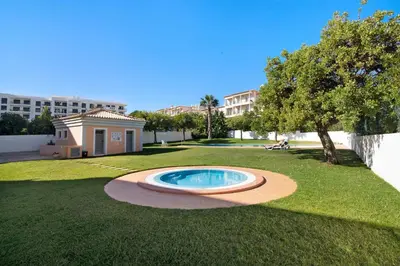 a small pool in the middle of a yard at Apartamento Água Brisa in Albufeira
