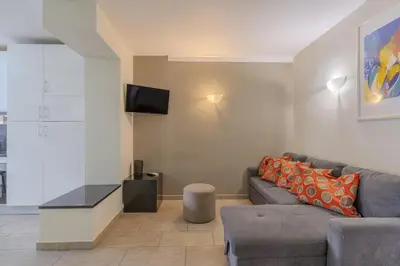a bedroom with a bed and a dresser in it at #018 T2 Elisabete by Home Holidays in Albufeira