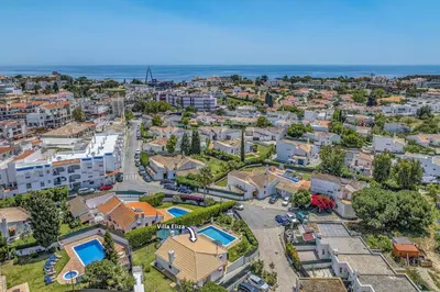 an aerial view of a city with buildings and the ocean at Villa Eliza by Villa Plus in Albufeira