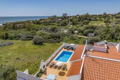 an aerial view of a house with a swimming pool at Villa Marrachinho by Villa Plus in Albufeira
