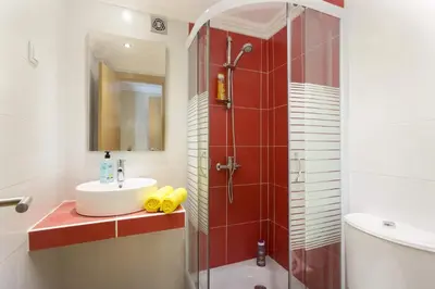 a bathroom with a shower and a sink and a toilet at Villa Siroco by Villa Plus in Albufeira