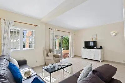 a living room with a couch and a table at Villa Uma by Villa Plus in Loulé