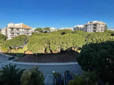 a view of a parking lot with trees and buildings at Falesia Beach Apartment in Albufeira