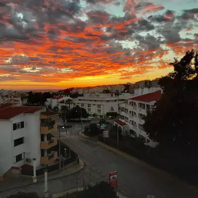a view of a city with a sunset at T1 Poente da Aldeia 336 Albufeira in Albufeira