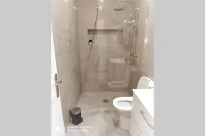a bathroom with a shower and a toilet at Old Town House in Loulé