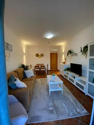 a living room with a couch and a table at Parra Holidays Q House in Guia