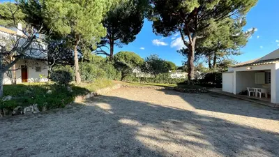 a driveway in front of a house with trees at Sol by Check-in Portugal in Vilamoura