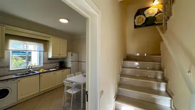 a kitchen with stairs and a sink in a kitchen at Ellegance by Check-in Portugal in Vilamoura