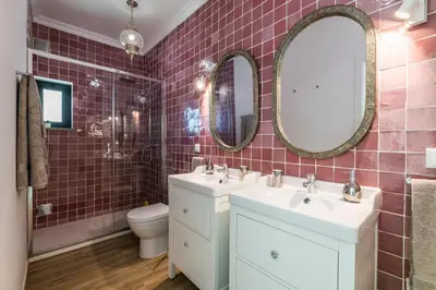 a bathroom with two sinks and a toilet at Riad Matias Galé - Luxury Villa with private pool, AC, free wifi, 5 min from the beach in Guia