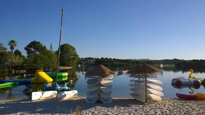 a group of boats on the water at a lake at Grey Heron Apartment in Quinta do Lago