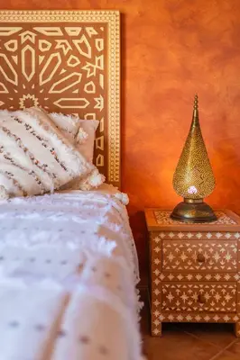 a bedroom with a bed and a lamp on a nightstand at Villa Oasis Galé - Luxury Villa with private pool, AC, free wifi, 5 min from the beach in Albufeira
