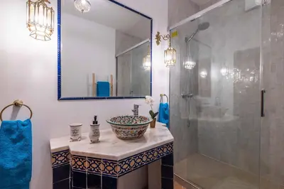 a bathroom with a sink and a shower at Villa Galé Sun - Luxury, 5bed with free wifi, AC, private pool, 5 min from the beach in Guia