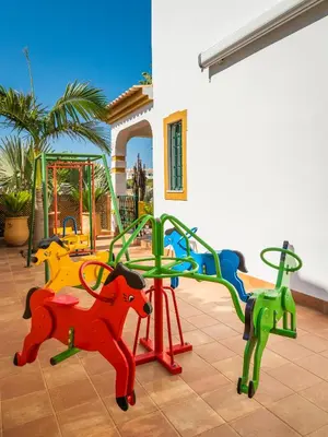 a playground with colorful play equipment in a house at Riad Serpa Galé - Luxury, private pool, AC, wifi, 5 min from the beach in Guia