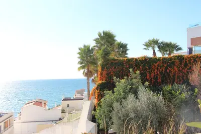 a view of the ocean from a building at Ocean and pool in Olhos de Água