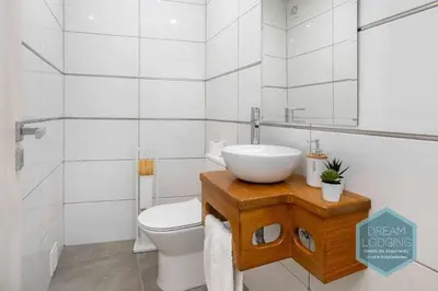 a bathroom with a sink and a toilet at Casa do Alto - Dream Lodging in Albufeira