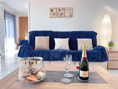 a bedroom with two beds and a ceiling fan at Sea & Sun WindMill Apartment by Be Cherish in Albufeira