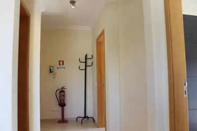 a bedroom with a large bed with shoes on it at AP Casa Monte da Balaia in Albufeira