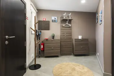 a room with a dresser and a closet at Marina Luxor - Vilamoura in Quarteira
