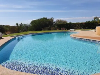 a large swimming pool with blue water at Wonderful View - Quinta da Colina C8 in Albufeira