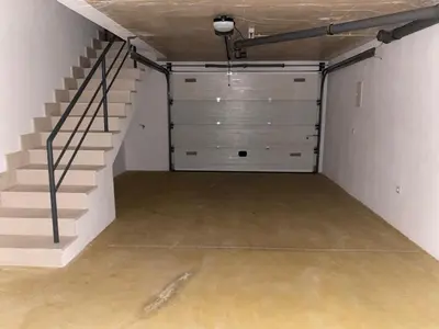 an empty garage with stairs and a stair case at Wonderful View - Quinta da Colina C8 in Albufeira
