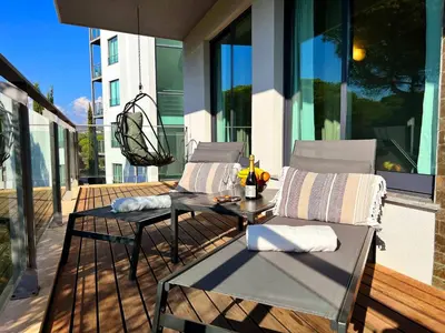 a bedroom with a large bed and a window at Residence Golf Club Vilamoura by Be Cherish in Quarteira