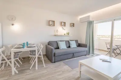 a balcony with a bench and a view of the city at #048 Sunrise by Home Holidays in Vale de Pedras