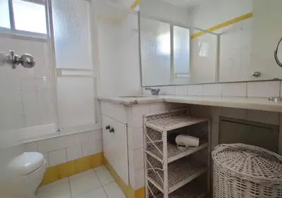 a bathroom with a sink and a toilet and a mirror at Cosy studio apartment in Vilamoura in Quarteira