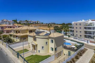 an aerial view of a house with a pool at Villa Carvalho by Villa Plus in Albufeira