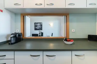 a kitchen with a bowl of fruit on a counter at RESIDENCE GOLF CLUB by Intiholidays in Vilamoura