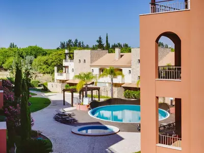 a view of the pool from the balcony of a resort at AL - Victoria Gardens in Vilamoura