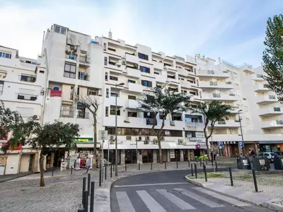 a large white building with a street in front of it at Old Town Apartment by Stay ici Algarve Holiday Rental in Albufeira