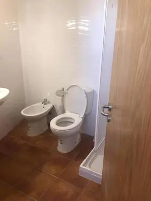 a bathroom with a toilet and a sink at CASA DO POÇO in Faro