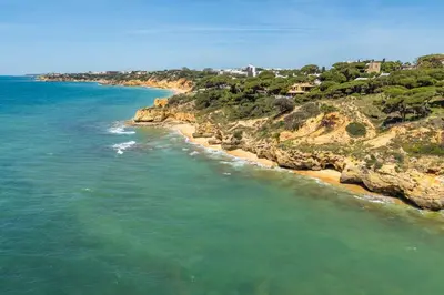 an aerial view of the ocean and a beach at T2 Eucalipto 2A by Algarneto in Olhos de Água