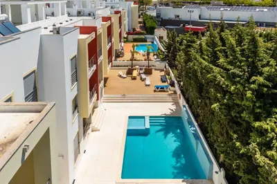 an overhead view of a swimming pool on a building at T2 Eucalipto 2A by Algarneto in Olhos de Água