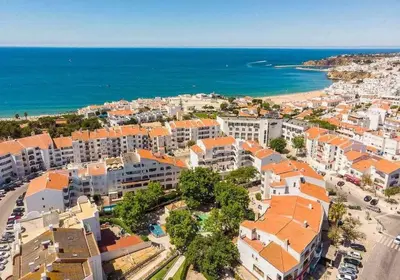 an aerial view of a city and the ocean at Central Town 2-Bedroom Apartment Albufeira in Albufeira