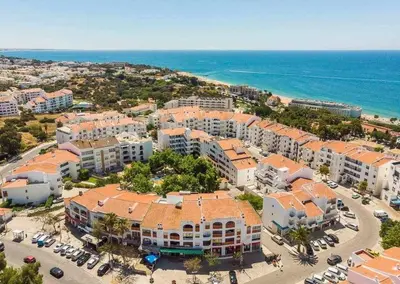 an aerial view of a resort near the ocean at Central Town 2-Bedroom Apartment Albufeira in Albufeira