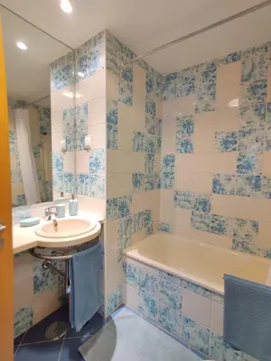 a bathroom with a tub and a sink and a bath tub at Albufeira Marina Views in Albufeira