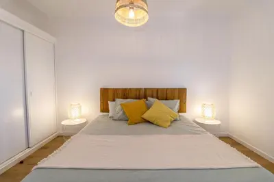 a bedroom with a bed with towels on it at #063 Beach Flat by Home Holidays in Albufeira