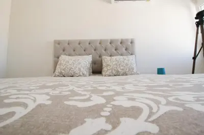 a bedroom with a large bed with pillows on it at Downtown Dreams in Faro