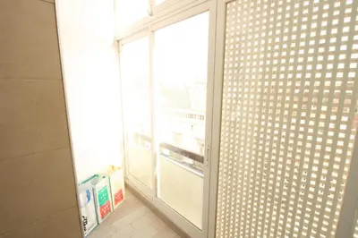 a sliding glass door to an empty refrigerator at Downtown Dreams in Faro