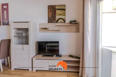 a living room with a tv and a fireplace at #057 T1 Rossio 43D by Home Holidays in Albufeira