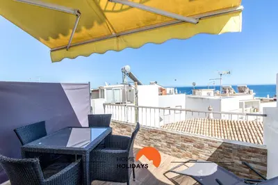 a balcony with a table and chairs and the ocean at #057 T1 Rossio 43D by Home Holidays in Albufeira