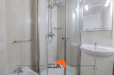 a bathroom with a shower and a sink and a toilet at #057 T1 Rossio 43D by Home Holidays in Albufeira