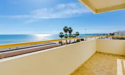 a balcony with a view of the ocean at InfiniteSeaView - Quarteira at Homesbyfc in Quarteira